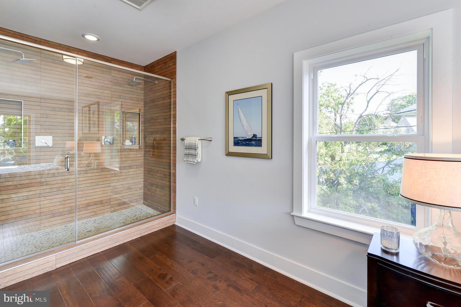 6729 Piney Branch Road Northwest Washington, DC 20012 - Photo 13 of 30 a view of wooden floor and a window in a room