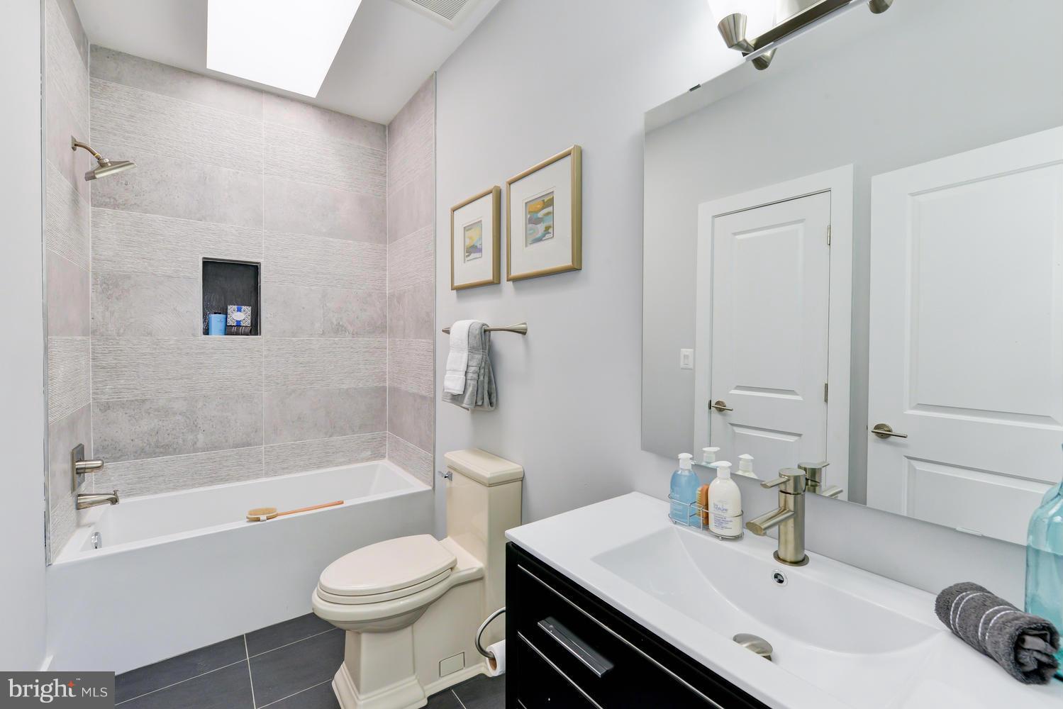 6729 Piney Branch Road Northwest Washington, DC 20012 - Photo 16 of 30 a bathroom with a sink toilet and shower