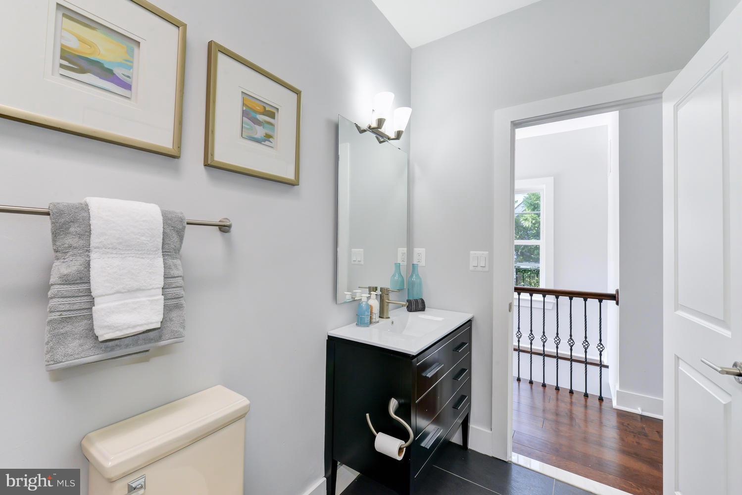 6729 Piney Branch Road Northwest Washington, DC 20012 - Photo 17 of 30 a bathroom with a sink and a mirror
