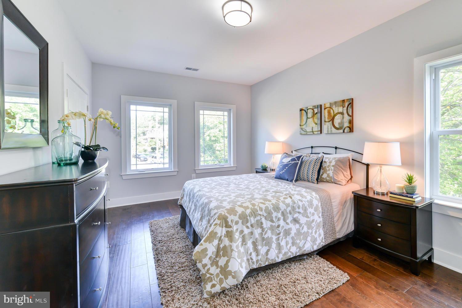 6729 Piney Branch Road Northwest Washington, DC 20012 - Photo 18 of 30 a bedroom with a bed and wooden floor