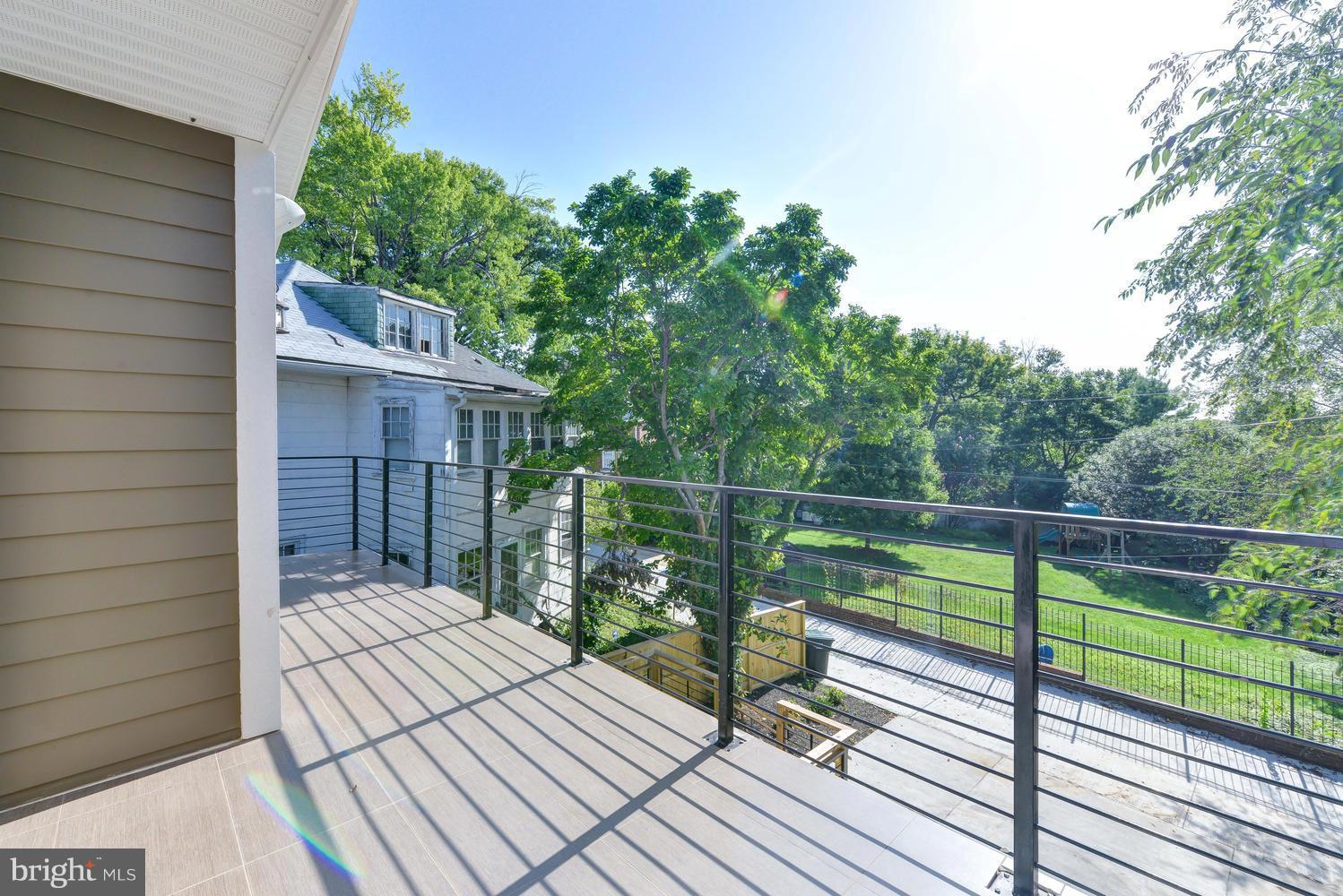 6729 Piney Branch Road Northwest Washington, DC 20012 - Photo 22 of 30 a balcony with wooden floor