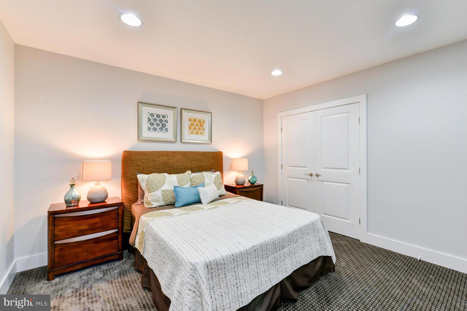 6729 Piney Branch Road Northwest Washington, DC 20012 - Photo 28 of 30 a bedroom with a bed and wooden floor