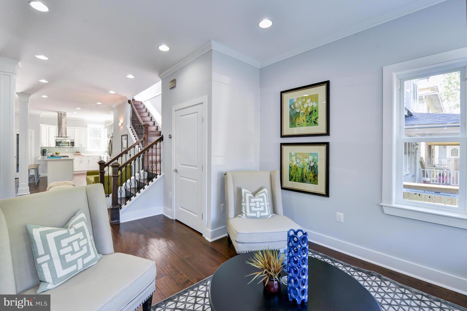 6729 Piney Branch Road Northwest Washington, DC 20012 - Photo 5 of 30 a living room with furniture and a wooden floor
