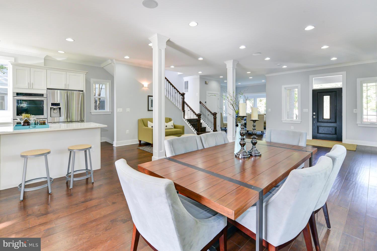6729 Piney Branch Road Northwest Washington, DC 20012 - Photo 8 of 30 a dining room with kitchen island a table and chairs
