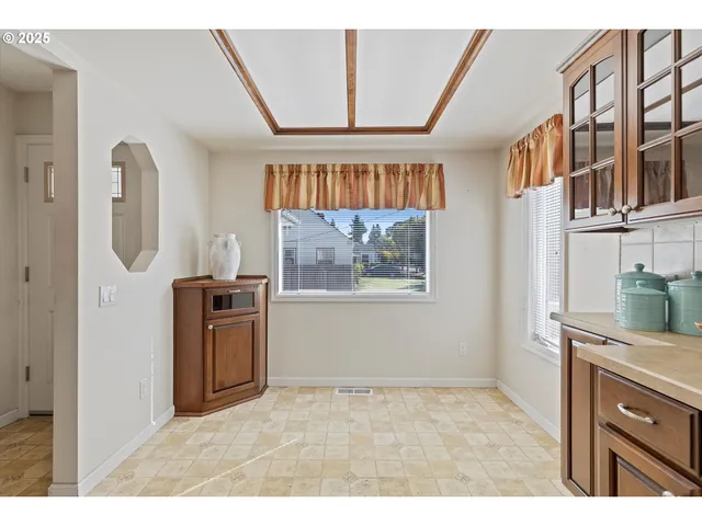 a kitchen with stainless steel appliances a refrigerator and a stove