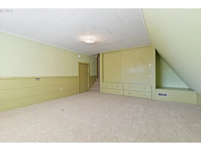 a bathroom with a shower and a sink