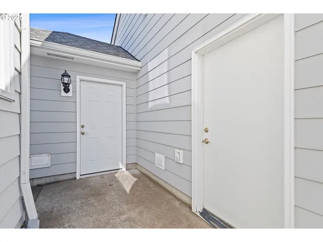 a view of a bathroom with a shower and a window