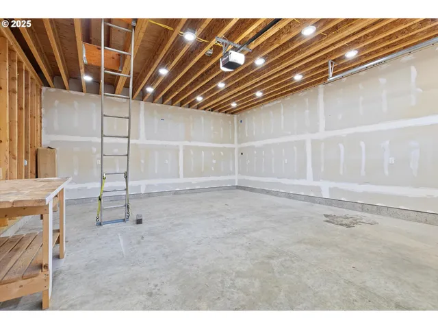 a view of a white house with a yard