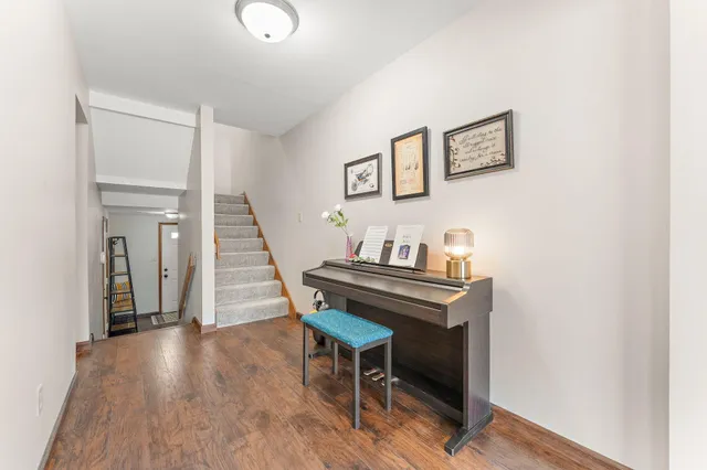 a view of a livingroom with furniture and wooden floor