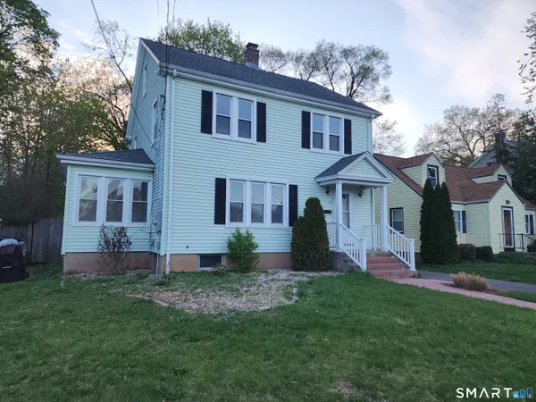 front view of a house with a yard