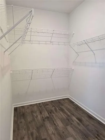 a bathroom with a shower and a sink