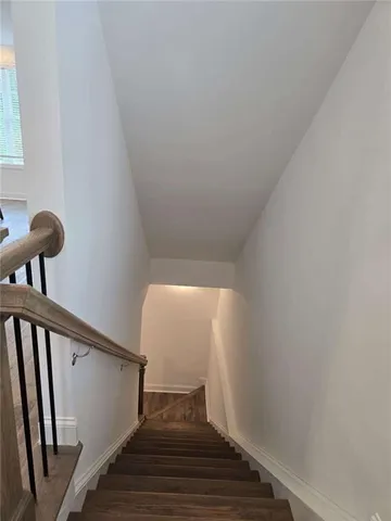 a white toilet sitting next to a bath tub