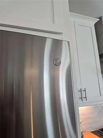 a view of storage and utility room with washer and dryer