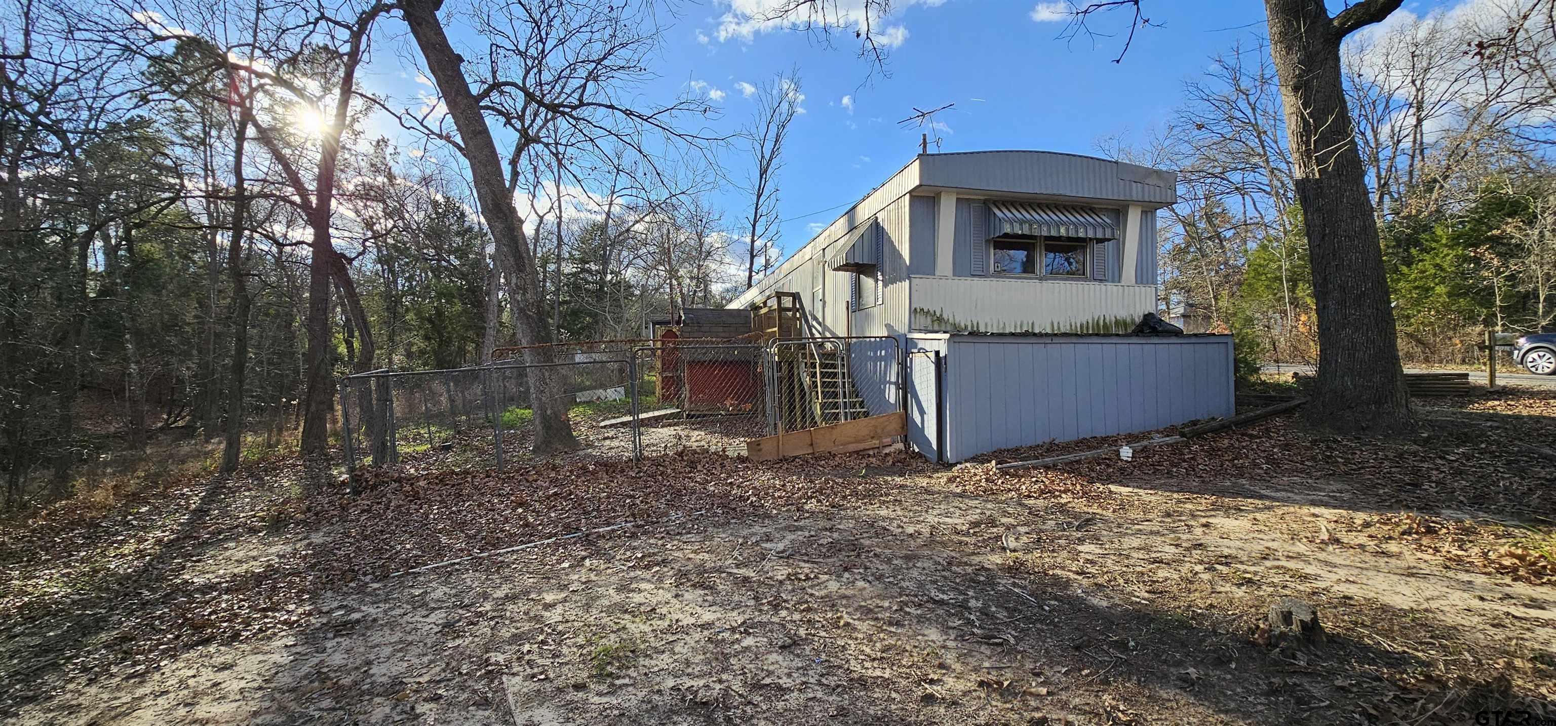 240 Elm Drive Murchison, TX 75778 - Photo 8 of 19 a front view of a house with garden