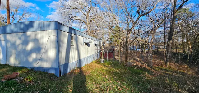 a view of swimming pool with a yard