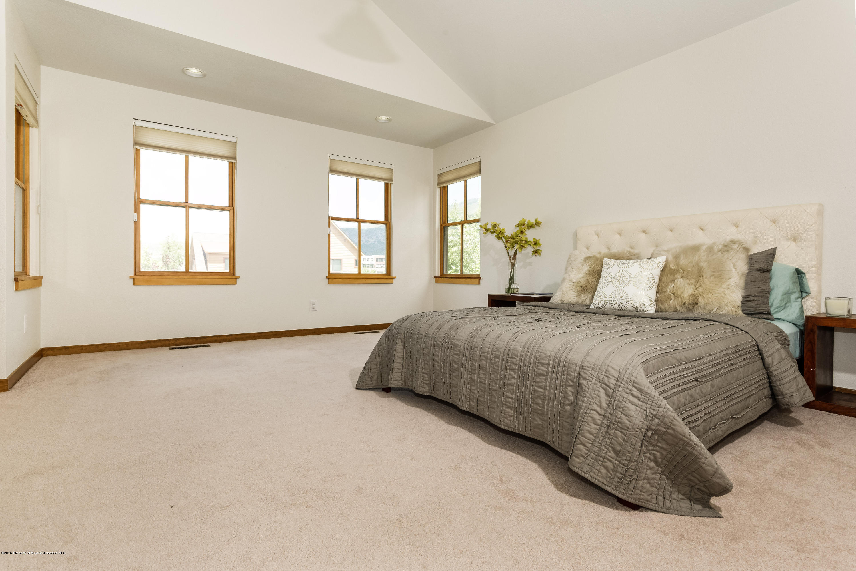 357 Sopris Circle Basalt, CO 81621 - Photo 19 of 24 a bedroom with a bed and a window