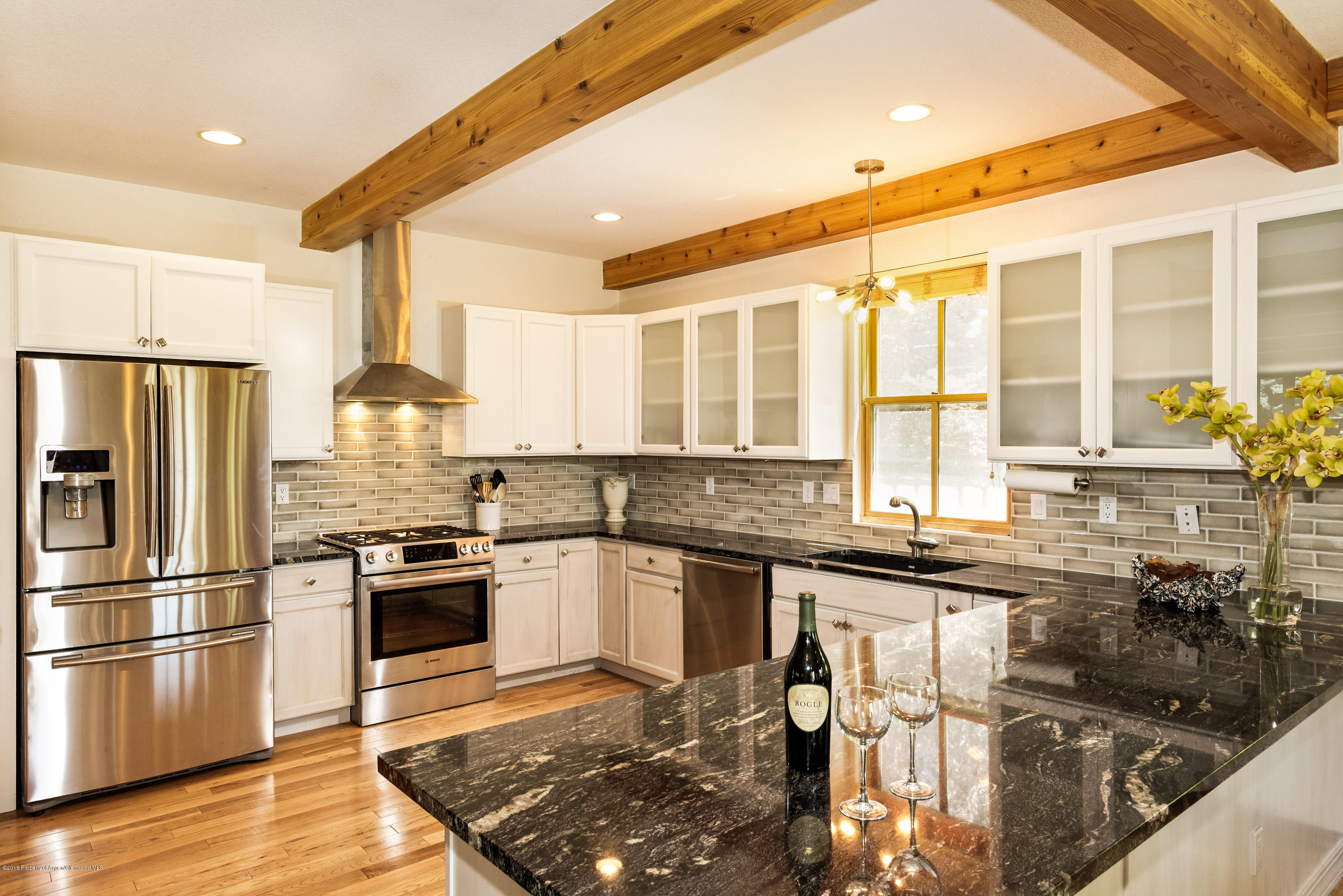 357 Sopris Circle Basalt, CO 81621 - Photo 8 of 24 a kitchen with stainless steel appliances granite countertop a stove and a refrigerator