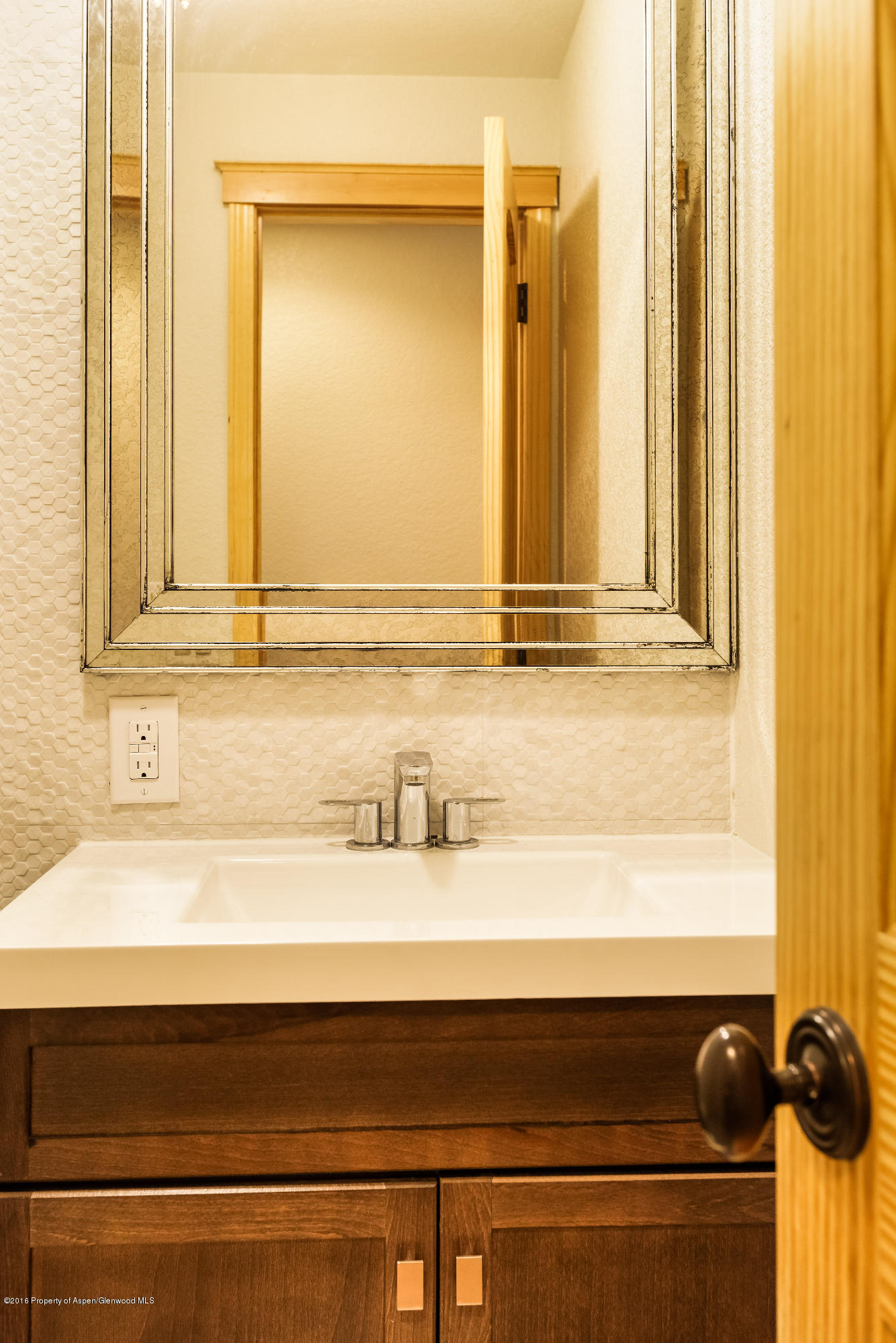 357 Sopris Circle Basalt, CO 81621 - Photo 9 of 24 a bathroom with a granite countertop sink and a mirror