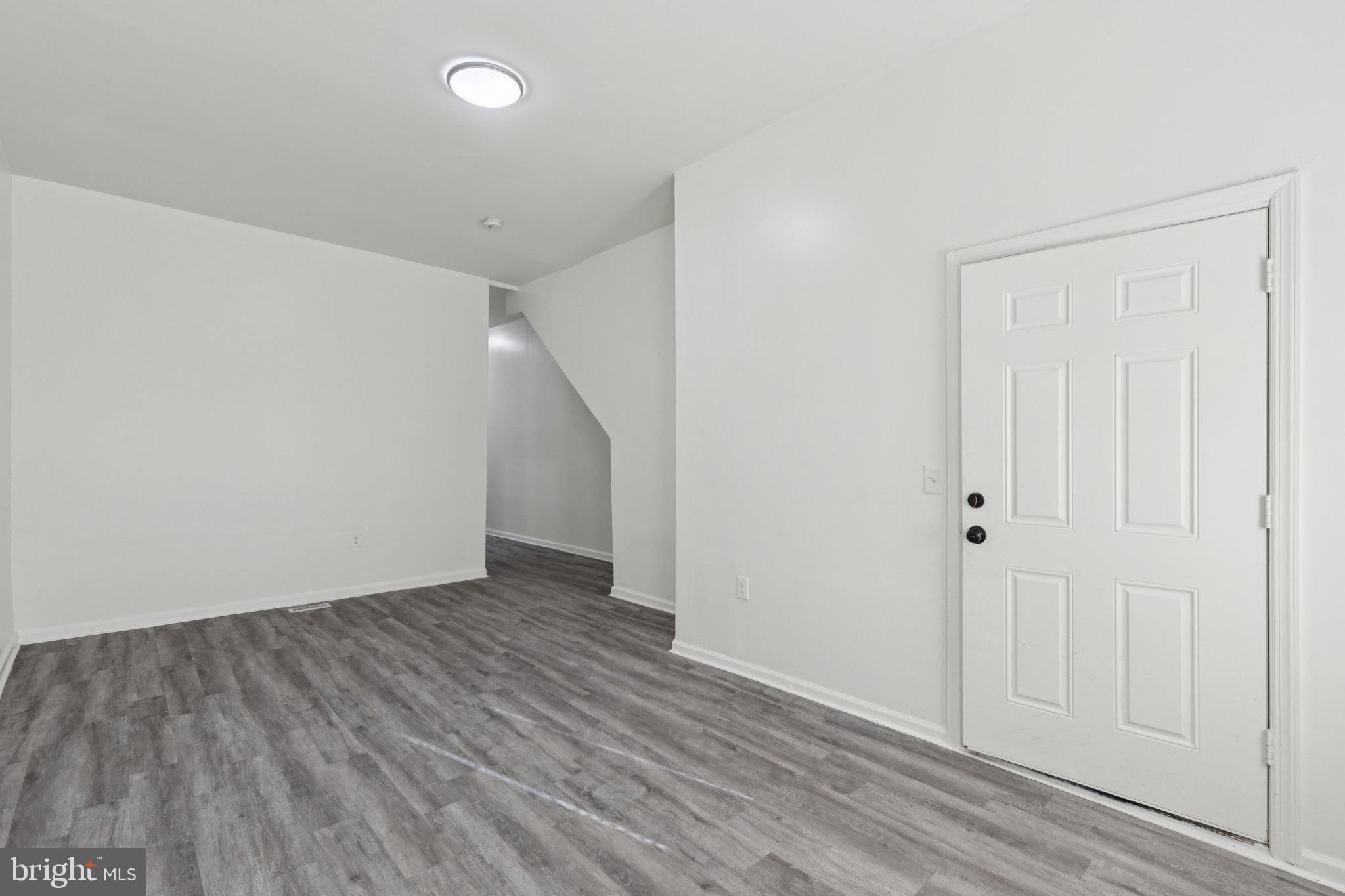 836 Haddon Avenue Camden, NJ 08103 - Photo 15 of 30 a view of an empty room with wooden floor