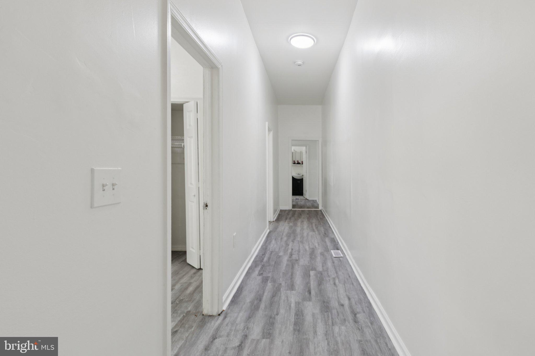 836 Haddon Avenue Camden, NJ 08103 - Photo 18 of 30 a view of a hallway with wooden floor