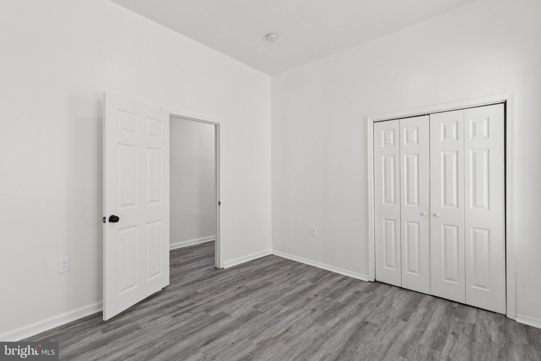 836 Haddon Avenue Camden, NJ 08103 - Photo 23 of 30 an empty room with wooden floor & closet area