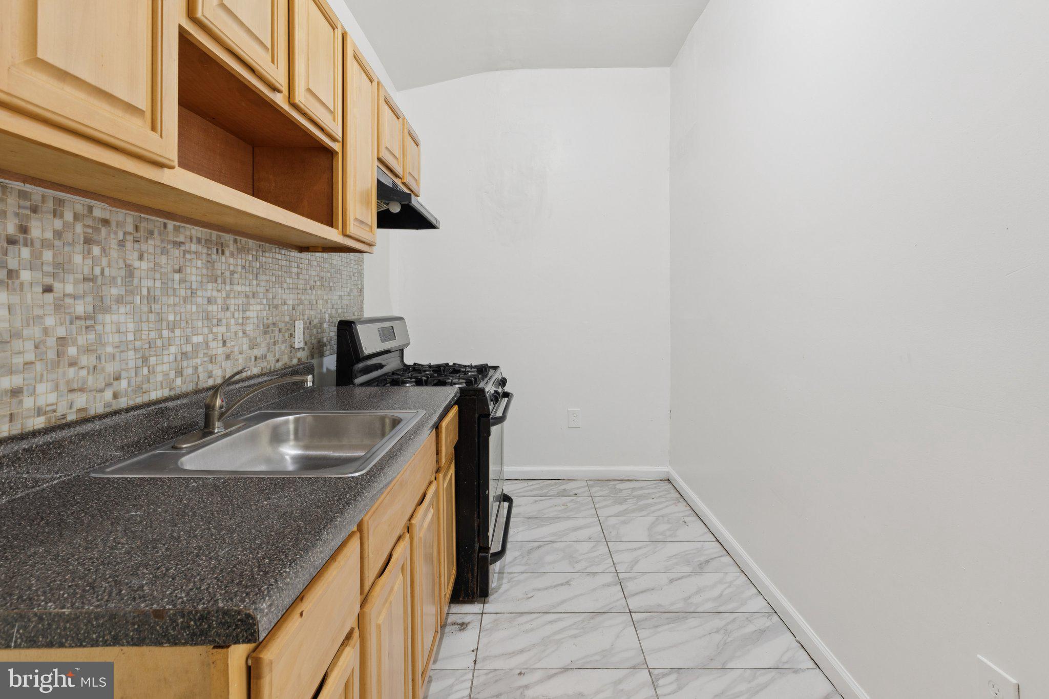 836 Haddon Avenue Camden, NJ 08103 - Photo 27 of 30 a kitchen with a sink and cabinets