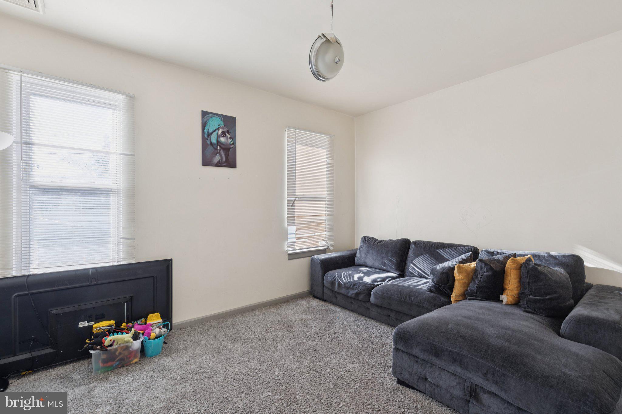 836 Haddon Avenue Camden, NJ 08103 - Photo 4 of 30 a living room with furniture and a window