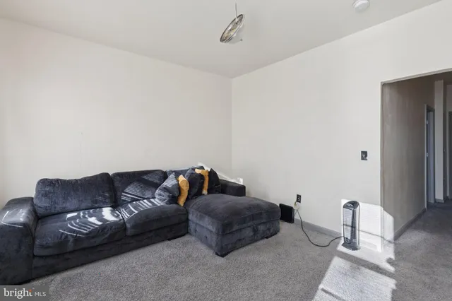 a kitchen with stainless steel appliances kitchen island granite countertop a stove a sink and a refrigerator