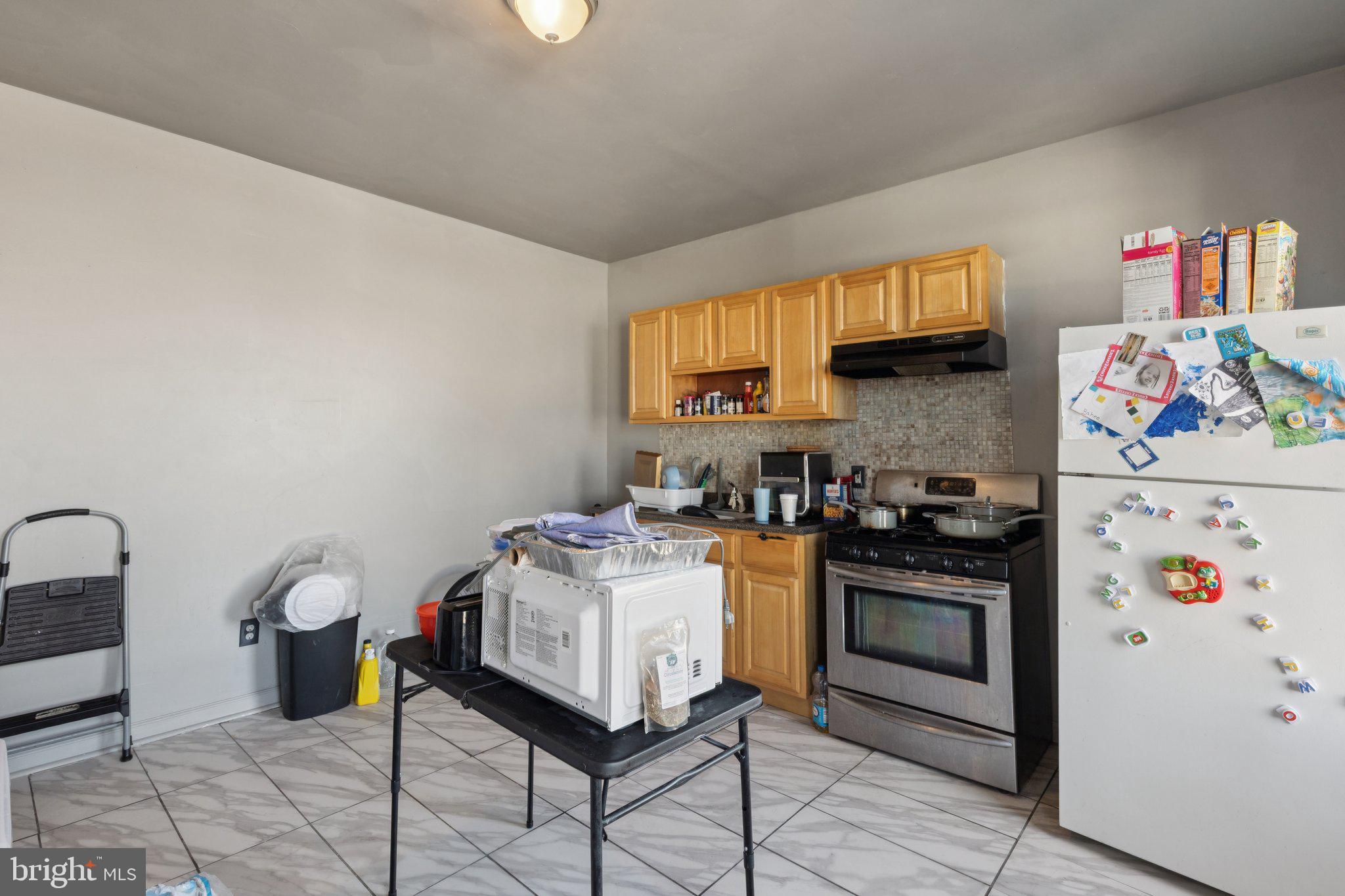 836 Haddon Avenue Camden, NJ 08103 - Photo 8 of 30 a kitchen with a stove and a refrigerator