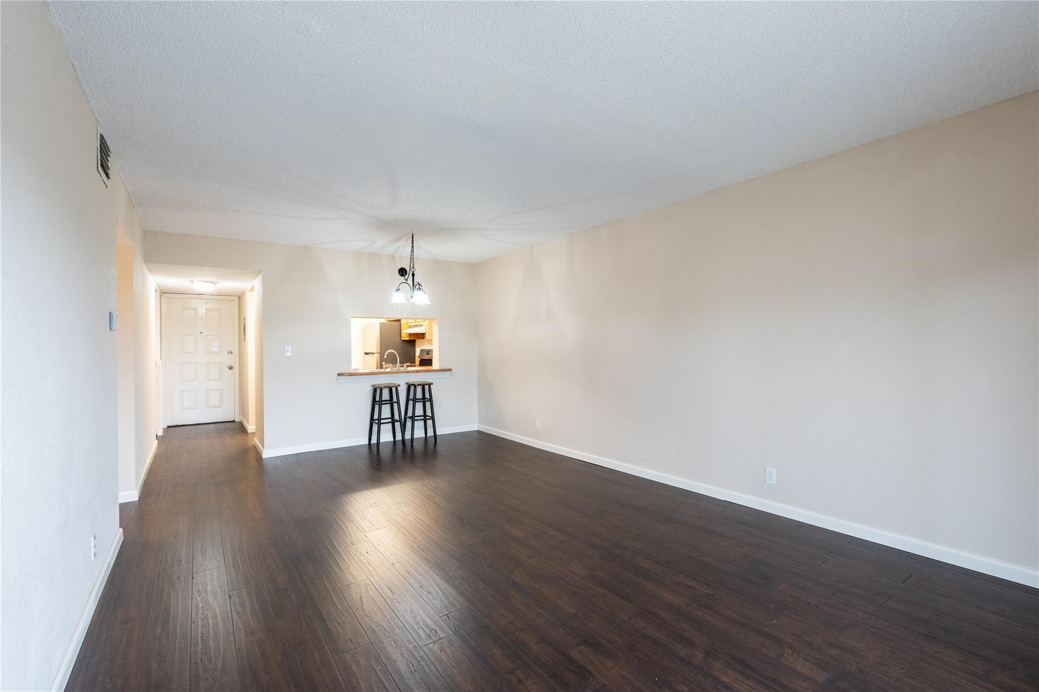 3720 North Pine Island Road, Unit 436 Sunrise, FL 33351 - Photo 11 of 26 a furnished livingroom with a window and wooden floor