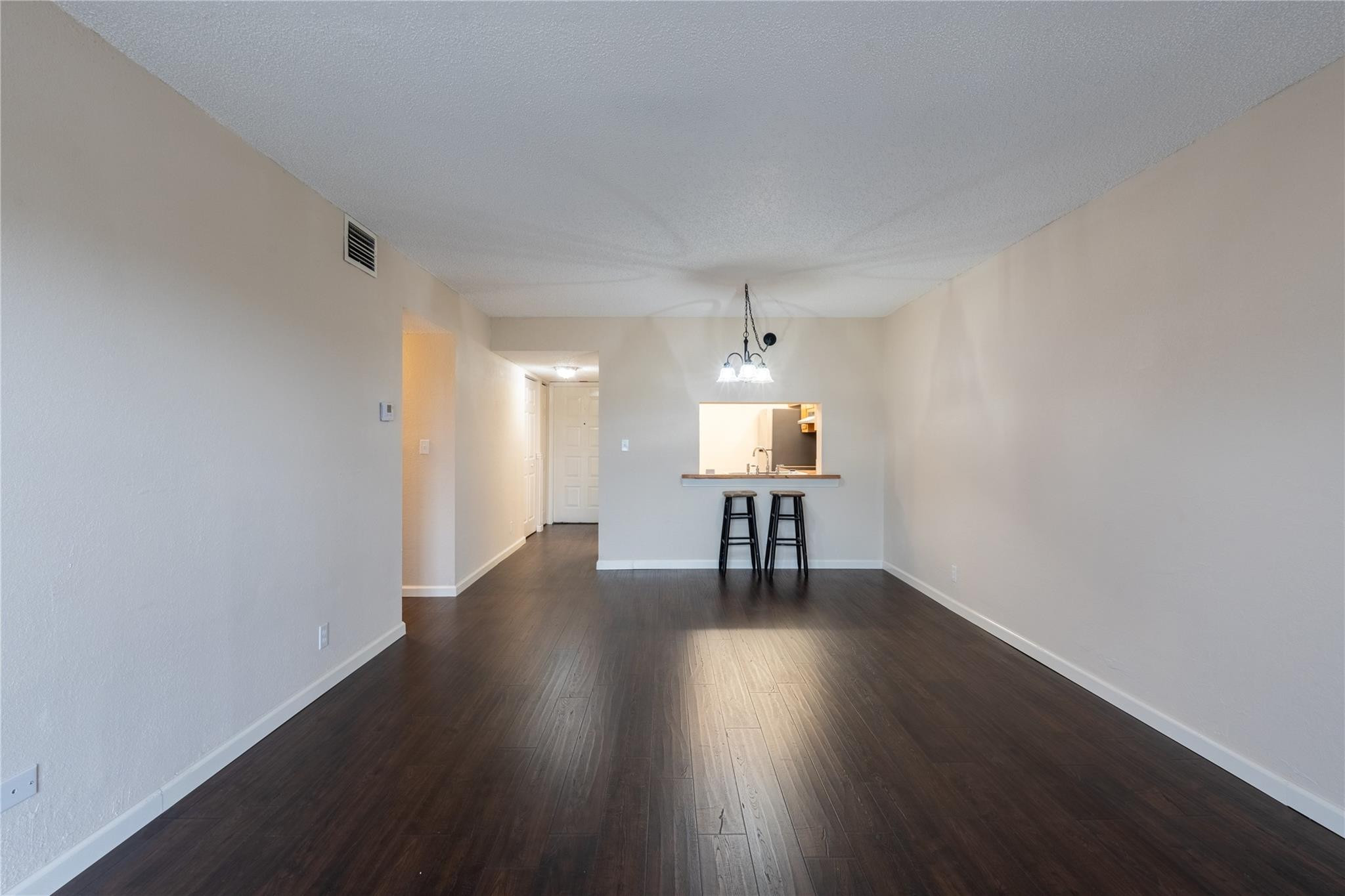 3720 North Pine Island Road, Unit 436 Sunrise, FL 33351 - Photo 12 of 26 a view of an empty room and wooden floor