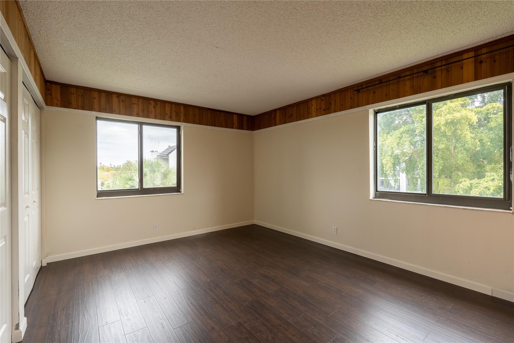 3720 North Pine Island Road, Unit 436 Sunrise, FL 33351 - Photo 14 of 26 a view of an empty room with wooden floor and a window