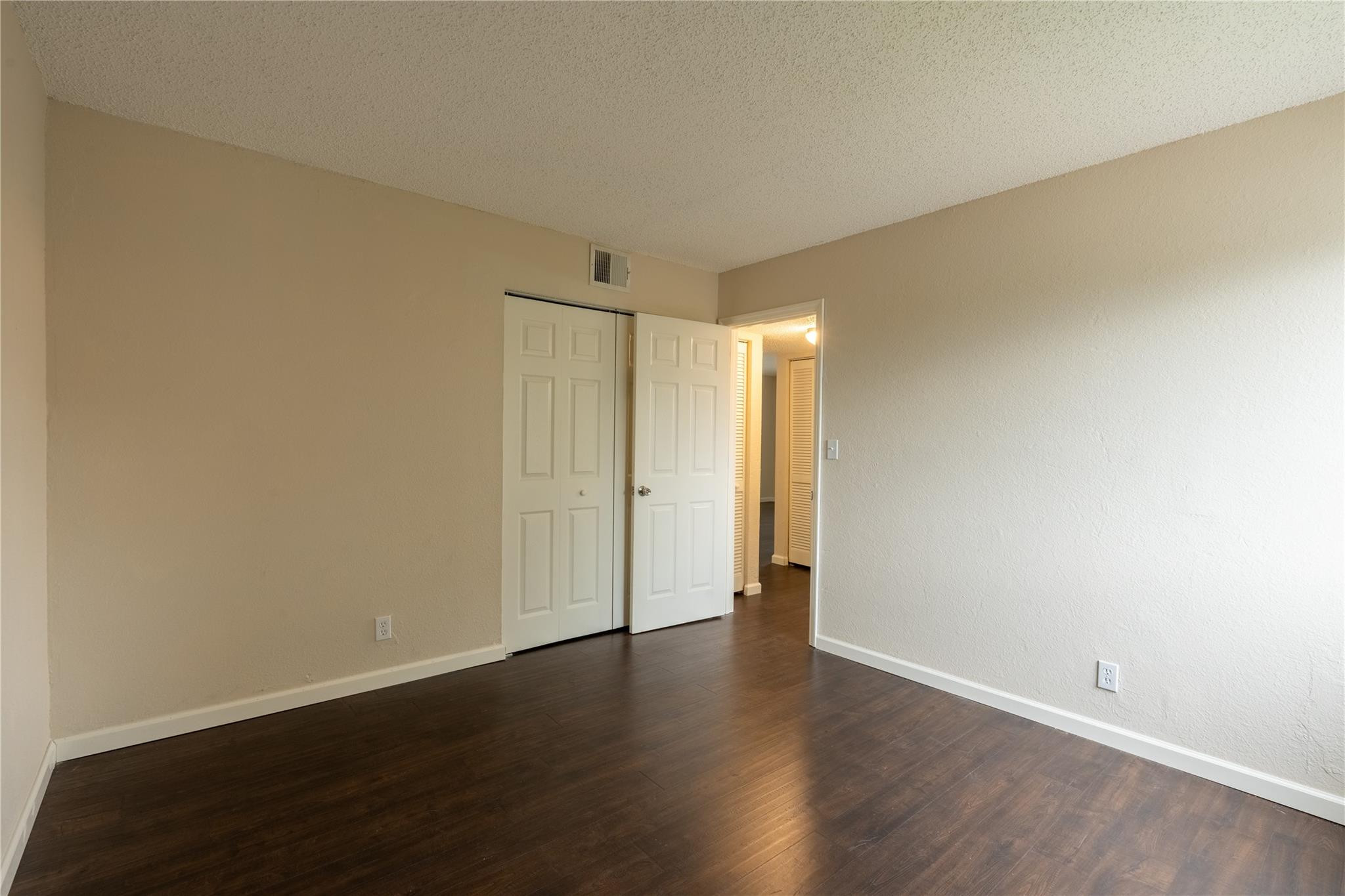 3720 North Pine Island Road, Unit 436 Sunrise, FL 33351 - Photo 21 of 26 a view of an empty room and wooden floor