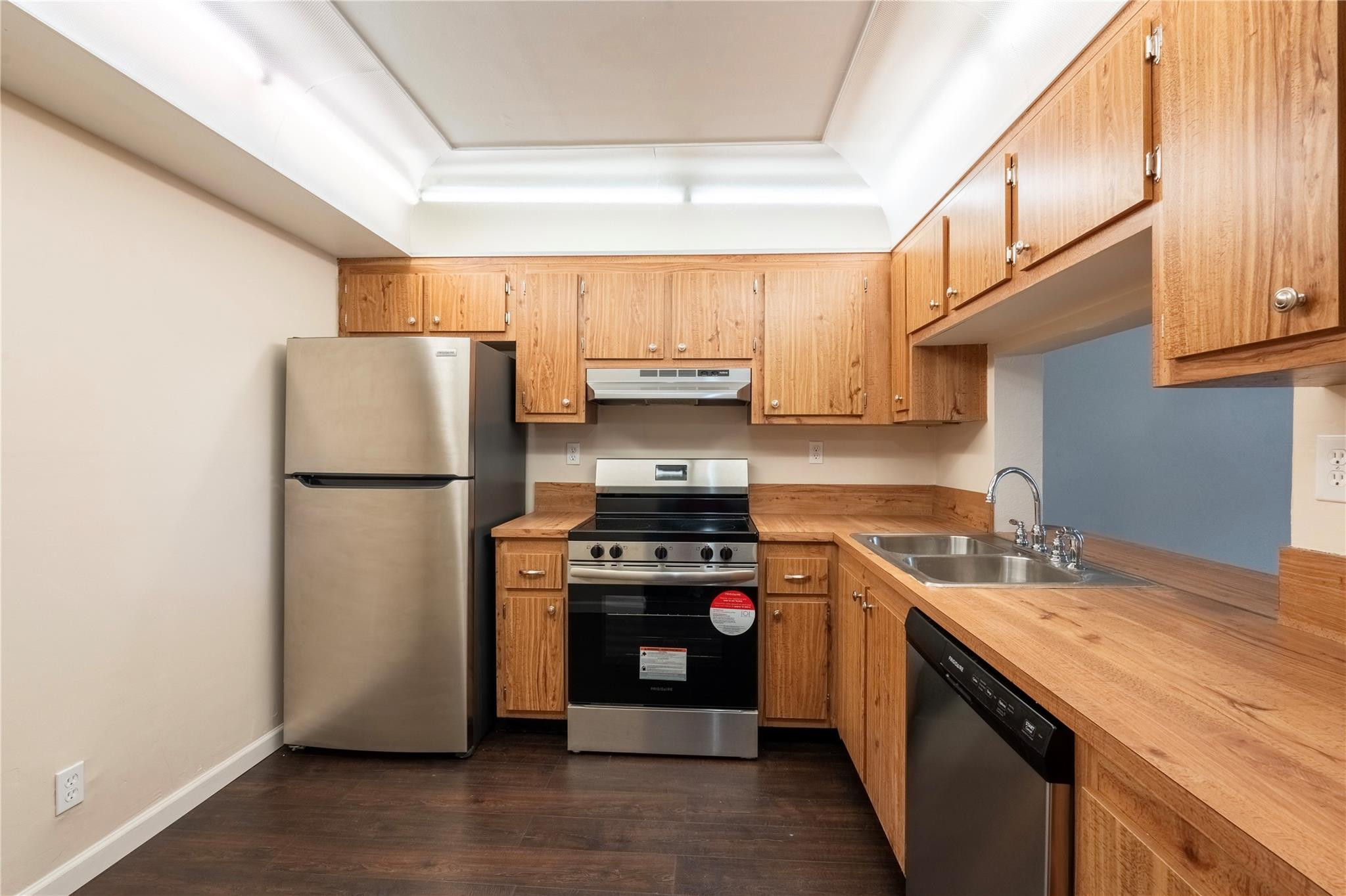 3720 North Pine Island Road, Unit 436 Sunrise, FL 33351 - Photo 4 of 26 a kitchen with a refrigerator sink and stove