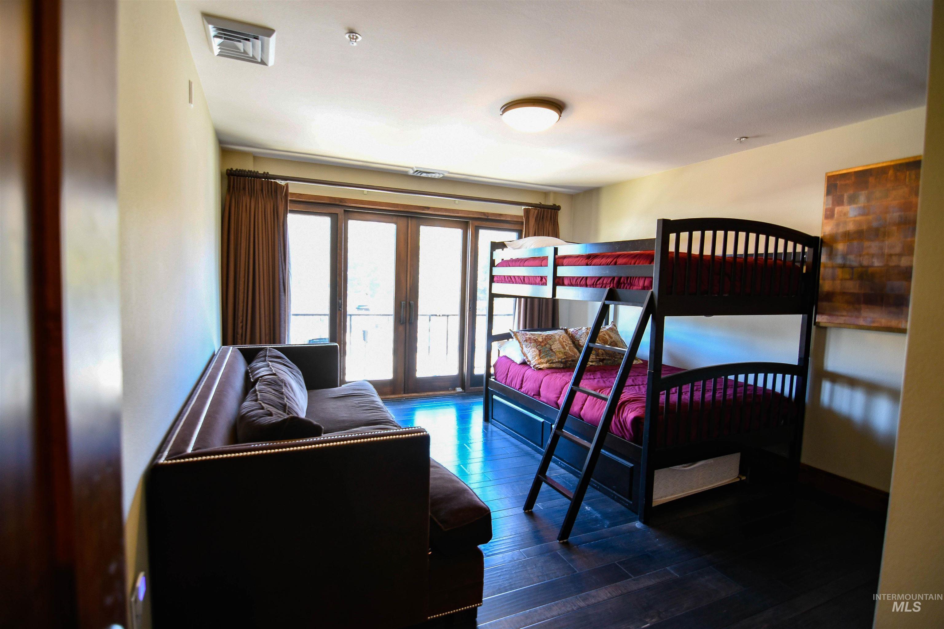 616 North 3rd Street, Unit 215 McCall, ID 83638 - Photo 23 of 36 Bedroom with dark wood-style flooring, access to outside, and french doors