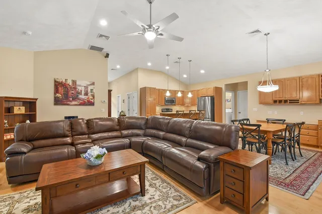 a living room with furniture fireplace and flat screen tv