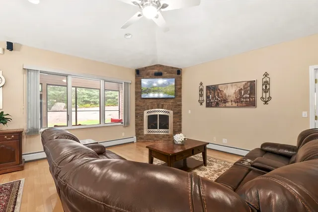 a living room with furniture and a fireplace