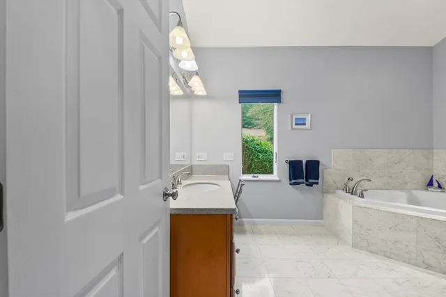 a bathroom with a bathtub and a toilet