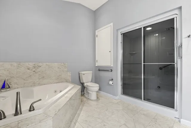 a bedroom with a bed closet and window