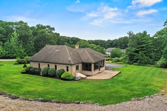 a view of a house with a yard porch and sitting area