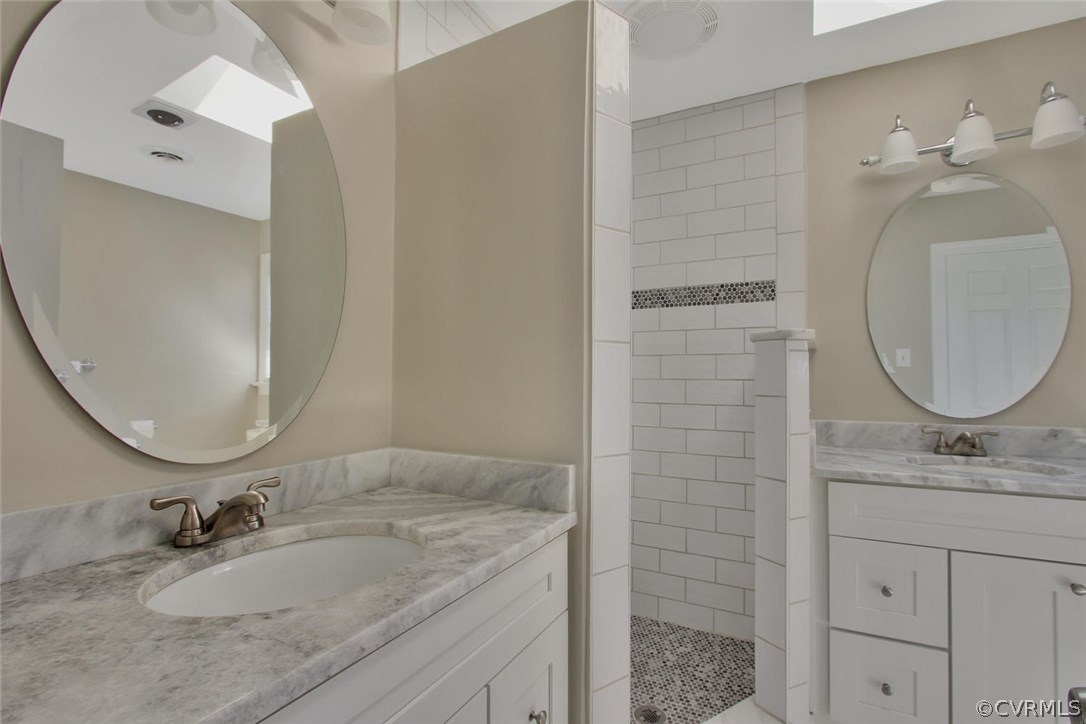 14303 Spring Gate Road Midlothian, VA 23112 - Photo 20 of 30 a bathroom with a granite countertop sink a mirror and shower