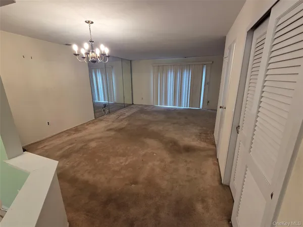 a view of a livingroom with a chandelier