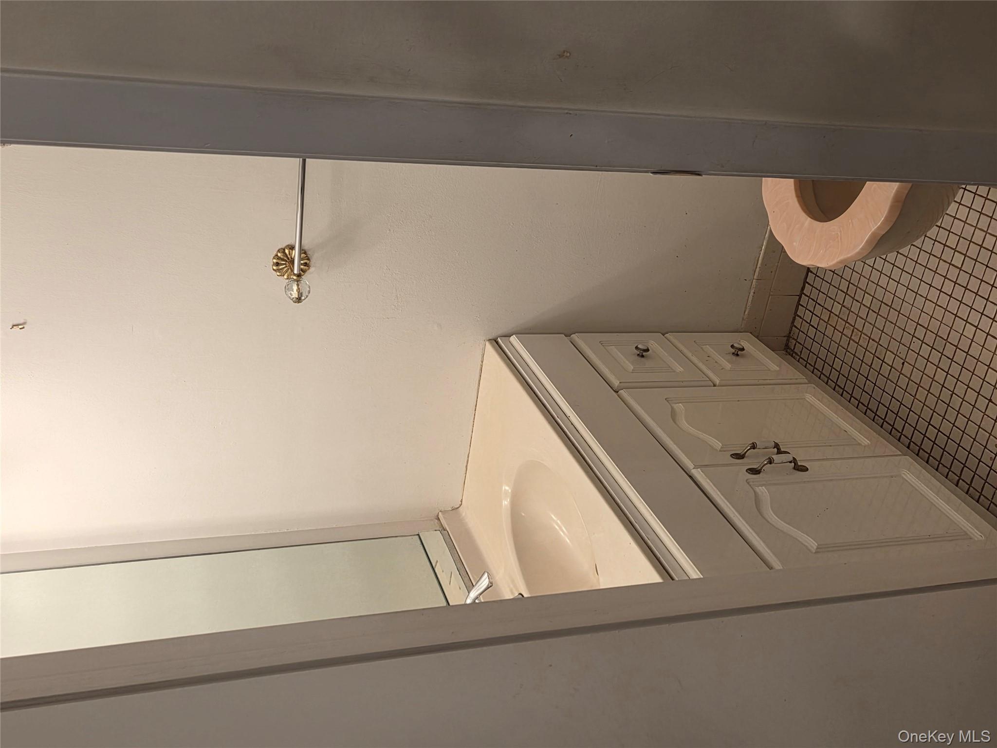 650 Newbridge Road, Unit 36 East Meadow, NY 11554 - Photo 7 of 14 a bathroom with a sink and toilet