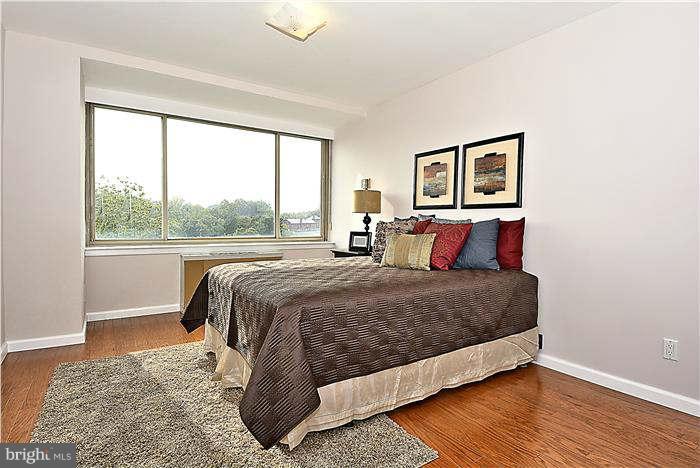 1210 North Taft Street, Unit 903 Arlington, VA 22201 - Photo 11 of 21 a bedroom with a large bed and a window
