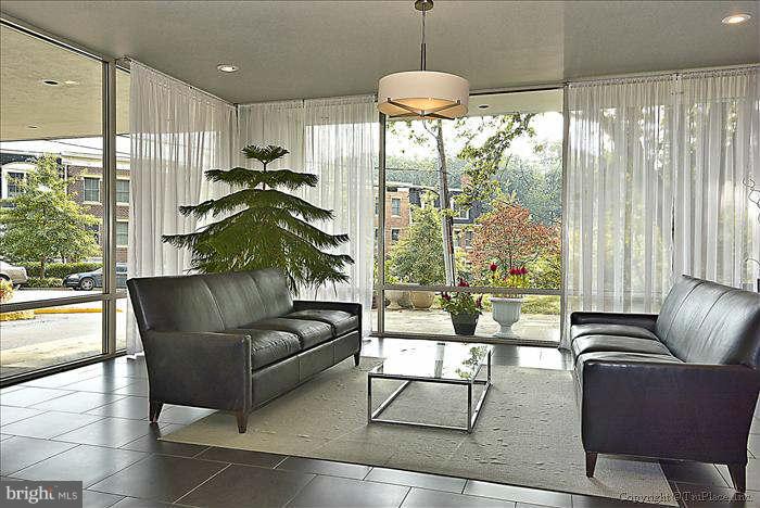 1210 North Taft Street, Unit 903 Arlington, VA 22201 - Photo 16 of 21 a living room with furniture and a large window