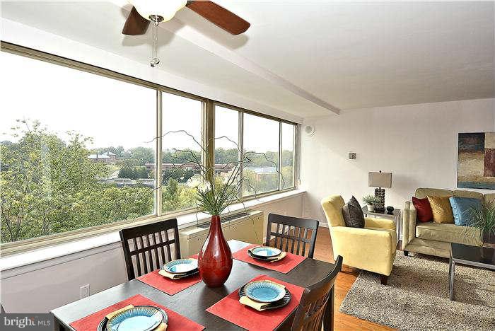 1210 North Taft Street, Unit 903 Arlington, VA 22201 - Photo 3 of 21 a living room with furniture and a large window