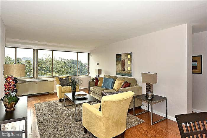 1210 North Taft Street, Unit 903 Arlington, VA 22201 - Photo 4 of 21 a living room with furniture and a large window
