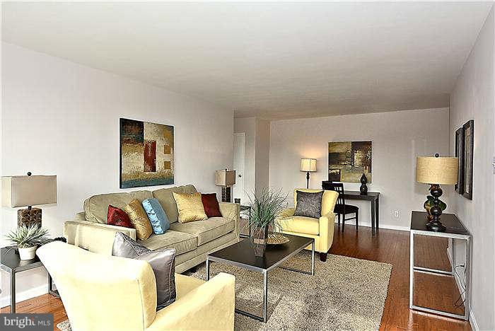 1210 North Taft Street, Unit 903 Arlington, VA 22201 - Photo 6 of 21 a living room with furniture and a flat screen tv