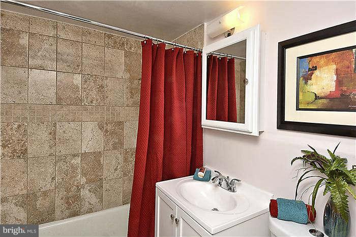 1210 North Taft Street, Unit 903 Arlington, VA 22201 - Photo 8 of 21 a bathroom with a sink and a mirror