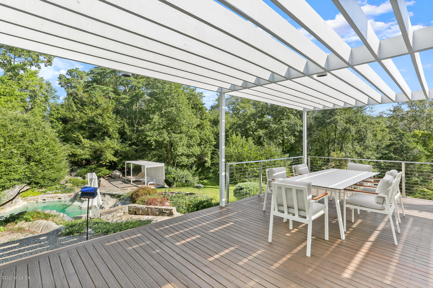 26 Chalburn Road Redding, CT 06896 - Photo 13 of 19 a patio with glass top table and chairs